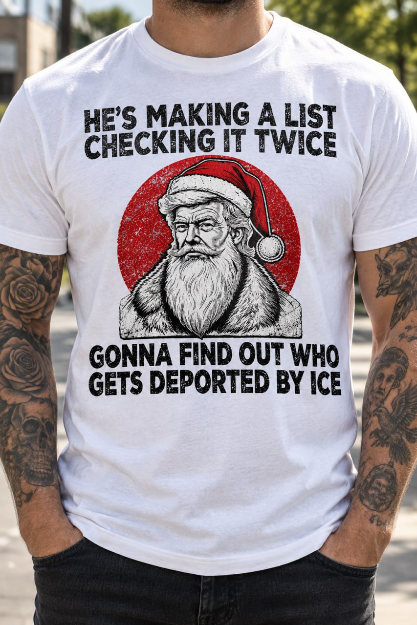 White He's Making a List Christmas graphic T-shirt with a Santa-hat portrait and political satire slogan