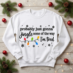 Mockup sweatshirt trắng in Jingle I’m tired trên nền gỗ